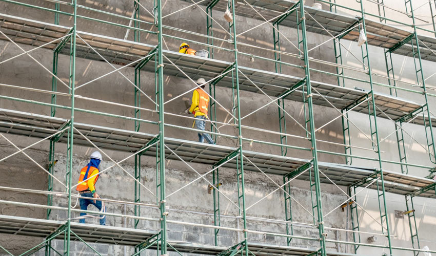 External scaffolding arranged around multiple elevations of a building