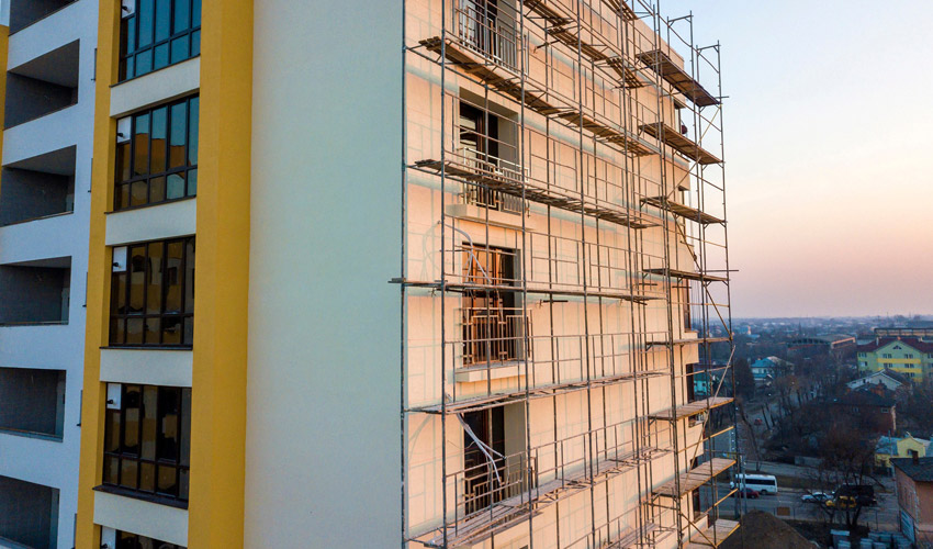 Tube-and-fitting scaffolding erected around a residential property